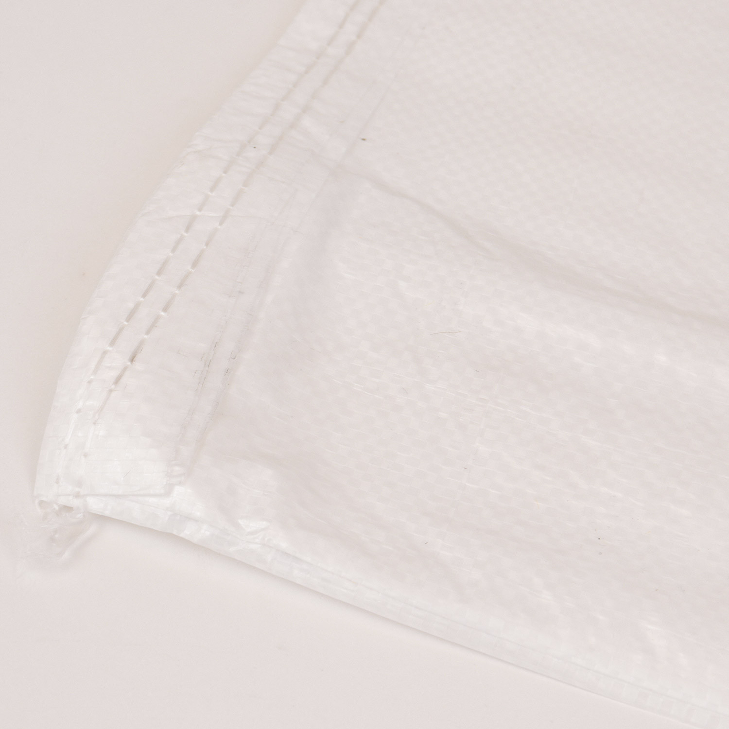 Saco laminado blanco 70 x 100 cm.